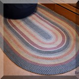 DR04. Oval braided rug. Approx. 5'2” x 7'10” 